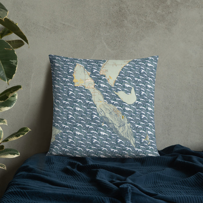 Custom Lummi Island Washington Map Throw Pillow in Woodblock on Bedding Against Wall
