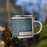 Right View Custom Mackinac Island Michigan Map Enamel Mug in Woodblock on Grass With Trees in Background