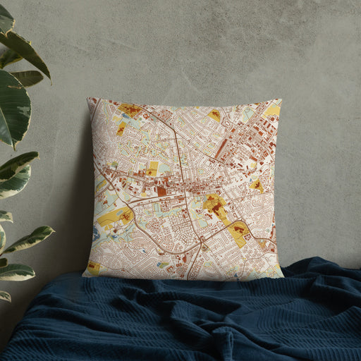 Custom Manassas Virginia Map Throw Pillow in Woodblock on Bedding Against Wall