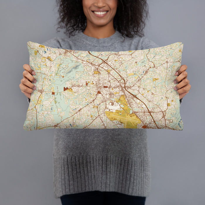 Person holding 20x12 Custom Marietta Georgia Map Throw Pillow in Woodblock