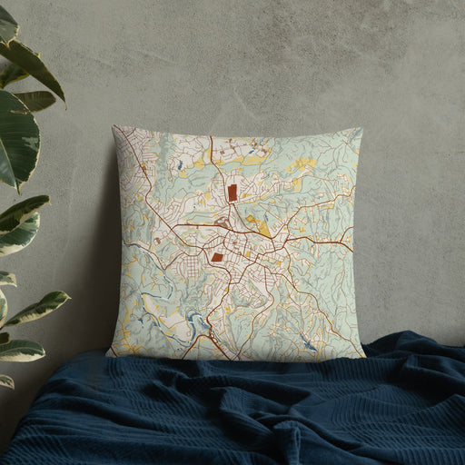 Custom Martinsville Virginia Map Throw Pillow in Woodblock on Bedding Against Wall