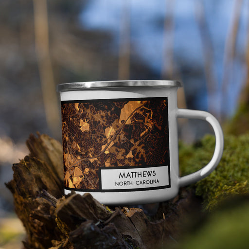 Right View Custom Matthews North Carolina Map Enamel Mug in Ember on Grass With Trees in Background
