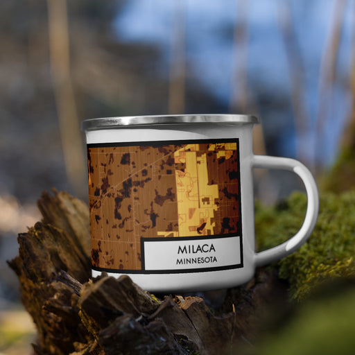 Right View Custom Milaca Minnesota Map Enamel Mug in Ember on Grass With Trees in Background