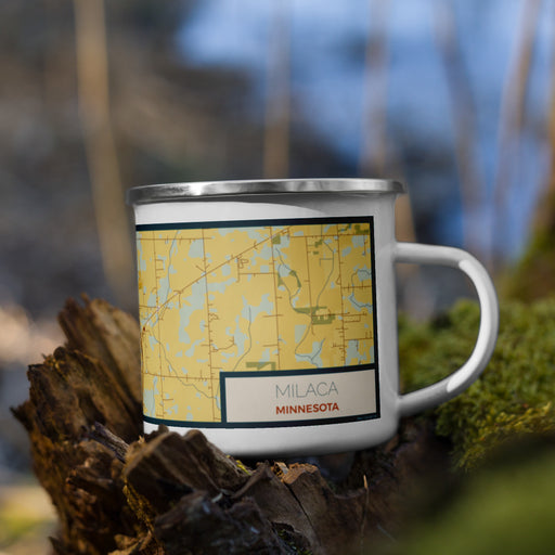 Right View Custom Milaca Minnesota Map Enamel Mug in Woodblock on Grass With Trees in Background