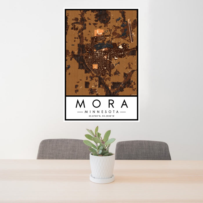24x36 Mora Minnesota Map Print Portrait Orientation in Ember Style Behind 2 Chairs Table and Potted Plant