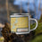 Right View Custom Mora Minnesota Map Enamel Mug in Woodblock on Grass With Trees in Background