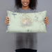 Person holding 20x12 Custom Mount Bachelor Oregon Map Throw Pillow in Woodblock