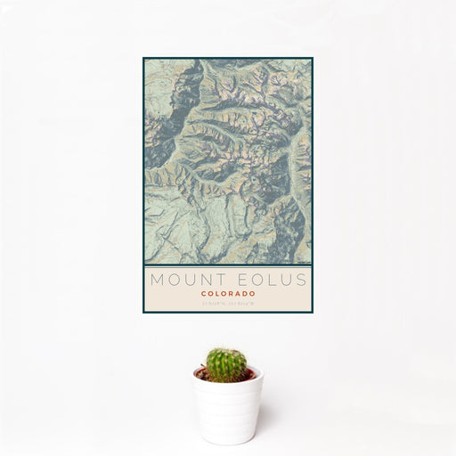 12x18 Mount Eolus Colorado Map Print Portrait Orientation in Woodblock Style With Small Cactus Plant in White Planter