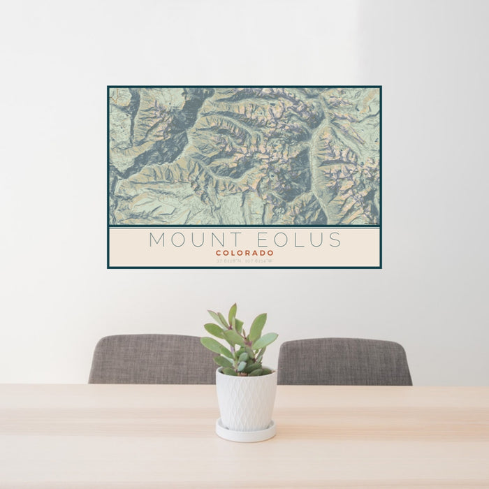 24x36 Mount Eolus Colorado Map Print Lanscape Orientation in Woodblock Style Behind 2 Chairs Table and Potted Plant
