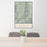 24x36 Mount Mitchell North Carolina Map Print Portrait Orientation in Woodblock Style Behind 2 Chairs Table and Potted Plant