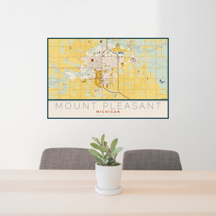 24x36 Mount Pleasant Michigan Map Print Lanscape Orientation in Woodblock Style Behind 2 Chairs Table and Potted Plant