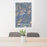 24x36 Mount Shuksan Washington Map Print Portrait Orientation in Afternoon Style Behind 2 Chairs Table and Potted Plant