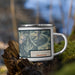 Right View Custom Mount Shuksan Washington Map Enamel Mug in Woodblock on Grass With Trees in Background