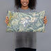 Person holding 20x12 Custom Mount Shuksan Washington Map Throw Pillow in Woodblock