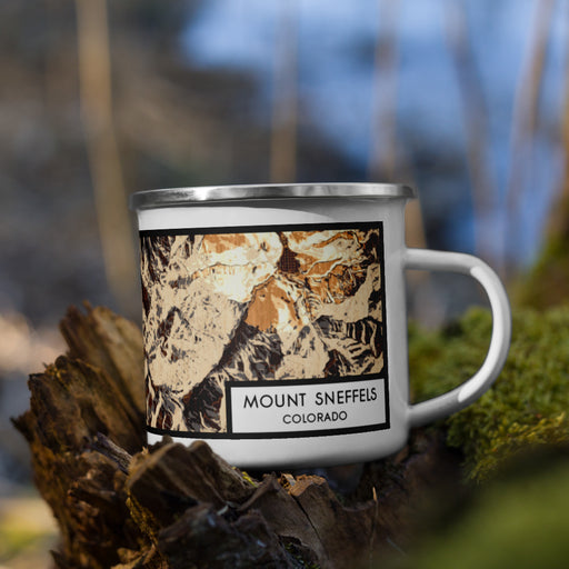 Right View Custom Mount Sneffels Colorado Map Enamel Mug in Ember on Grass With Trees in Background