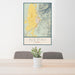 24x36 Nephi Utah Map Print Portrait Orientation in Woodblock Style Behind 2 Chairs Table and Potted Plant