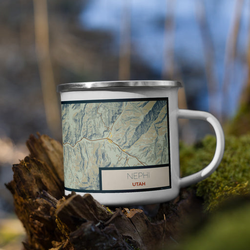 Right View Custom Nephi Utah Map Enamel Mug in Woodblock on Grass With Trees in Background