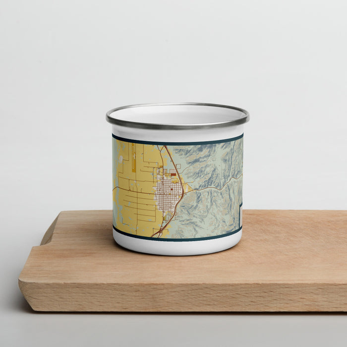 Front View Custom Nephi Utah Map Enamel Mug in Woodblock on Cutting Board