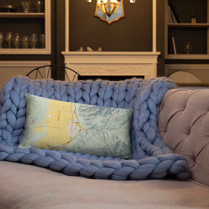 Custom Nephi Utah Map Throw Pillow in Woodblock on Blue Colored Chair