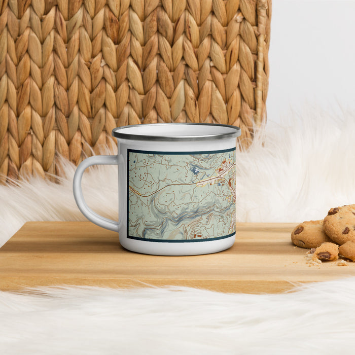 Left View Custom Nevada City California Map Enamel Mug in Woodblock on Table Top