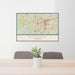 24x36 Newnan Georgia Map Print Landscape Orientation in Woodblock Style Behind 2 Chairs Table and Potted Plant