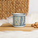 Left View Custom Newport Rhode Island Map Enamel Mug in Woodblock on Table Top