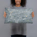 Person holding 20x12 Custom Newton Massachusetts Map Throw Pillow in Afternoon