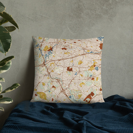 Custom Newton Massachusetts Map Throw Pillow in Woodblock on Bedding Against Wall