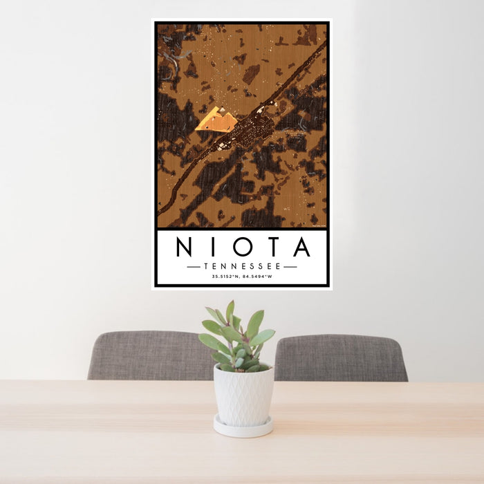 24x36 Niota Tennessee Map Print Portrait Orientation in Ember Style Behind 2 Chairs Table and Potted Plant