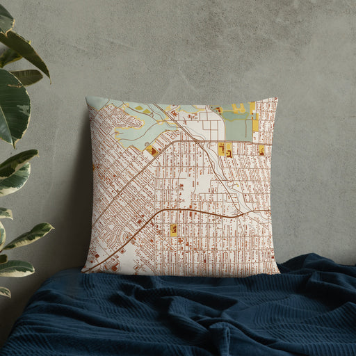 Custom Northside Historic District Fort Worth Map Throw Pillow in Woodblock on Bedding Against Wall