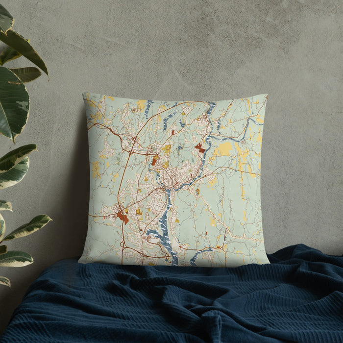 Custom Norwich Connecticut Map Throw Pillow in Woodblock on Bedding Against Wall