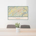 24x36 Oak Ridge Tennessee Map Print Lanscape Orientation in Woodblock Style Behind 2 Chairs Table and Potted Plant