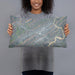 Person holding 20x12 Custom Oak Ridge Tennessee Map Throw Pillow in Afternoon