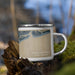 Right View Custom Ocean Isle Beach North Carolina Map Enamel Mug in Afternoon on Grass With Trees in Background