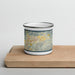 Front View Custom Ojai California Map Enamel Mug in Woodblock on Cutting Board