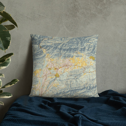 Custom Ojai California Map Throw Pillow in Woodblock on Bedding Against Wall
