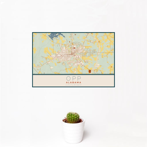 12x18 Opp Alabama Map Print Landscape Orientation in Woodblock Style With Small Cactus Plant in White Planter