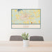 24x36 Opp Alabama Map Print Lanscape Orientation in Woodblock Style Behind 2 Chairs Table and Potted Plant