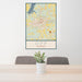 24x36 Opp Alabama Map Print Portrait Orientation in Woodblock Style Behind 2 Chairs Table and Potted Plant