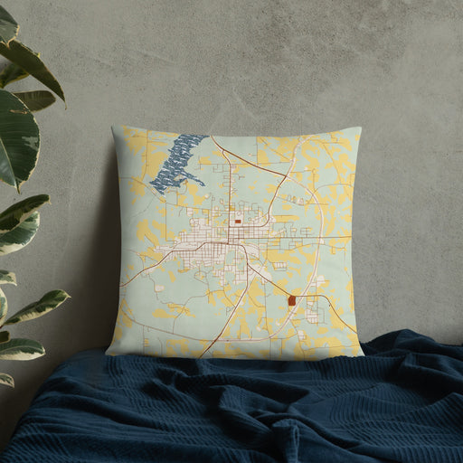 Custom Opp Alabama Map Throw Pillow in Woodblock on Bedding Against Wall