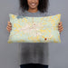 Person holding 20x12 Custom Opp Alabama Map Throw Pillow in Woodblock