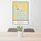 24x36 Ord Nebraska Map Print Portrait Orientation in Woodblock Style Behind 2 Chairs Table and Potted Plant