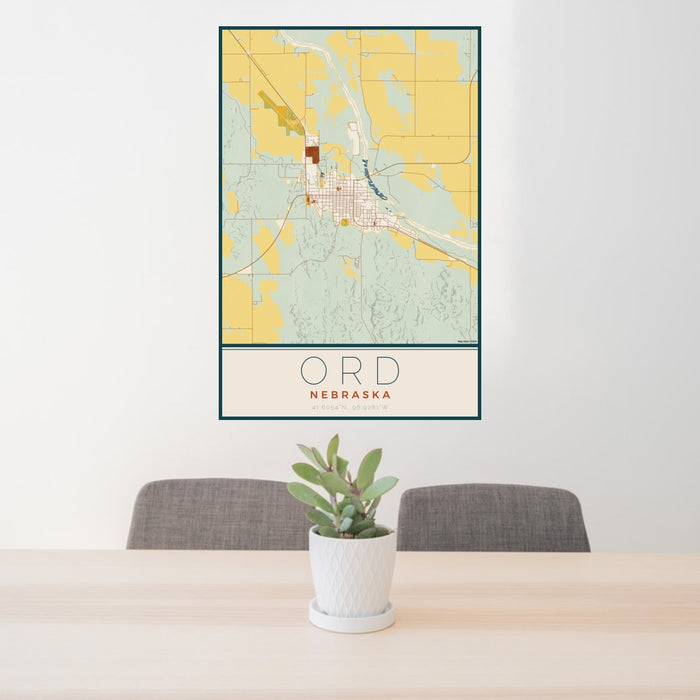 24x36 Ord Nebraska Map Print Portrait Orientation in Woodblock Style Behind 2 Chairs Table and Potted Plant