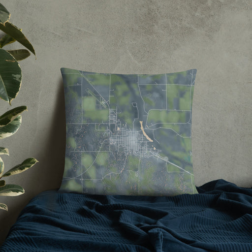 Custom Ord Nebraska Map Throw Pillow in Afternoon on Bedding Against Wall