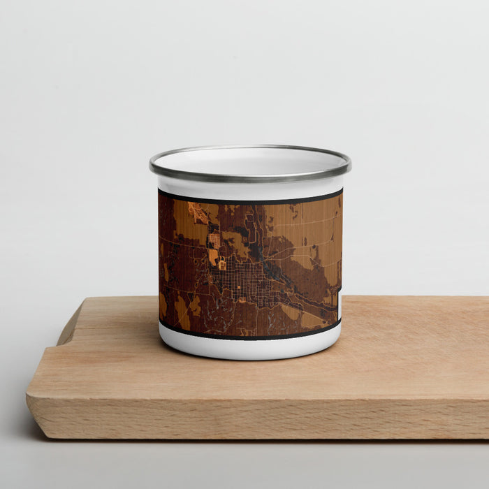 Front View Custom Ord Nebraska Map Enamel Mug in Ember on Cutting Board