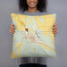 Person holding 18x18 Custom Ord Nebraska Map Throw Pillow in Woodblock