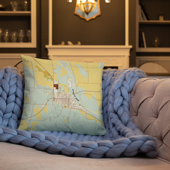 Custom Ord Nebraska Map Throw Pillow in Woodblock on Cream Colored Couch