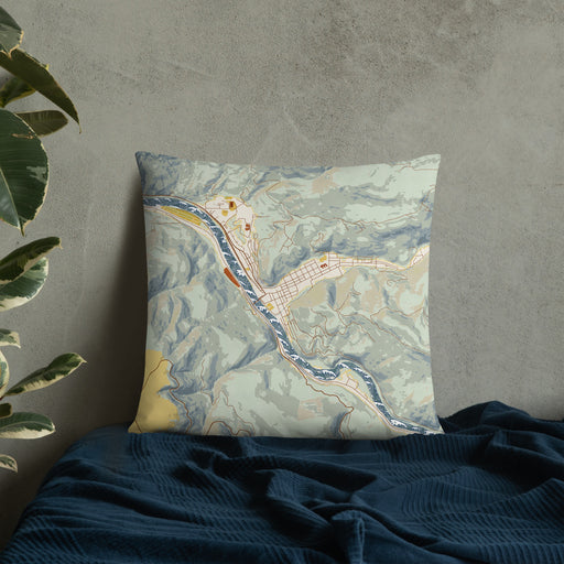 Custom Orofino Idaho Map Throw Pillow in Woodblock on Bedding Against Wall