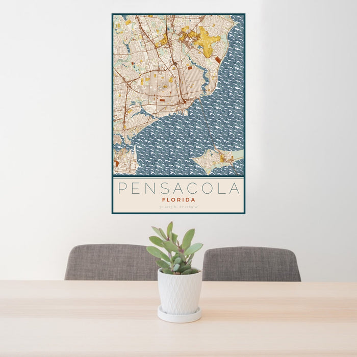 24x36 Pensacola Florida Map Print Portrait Orientation in Woodblock Style Behind 2 Chairs Table and Potted Plant