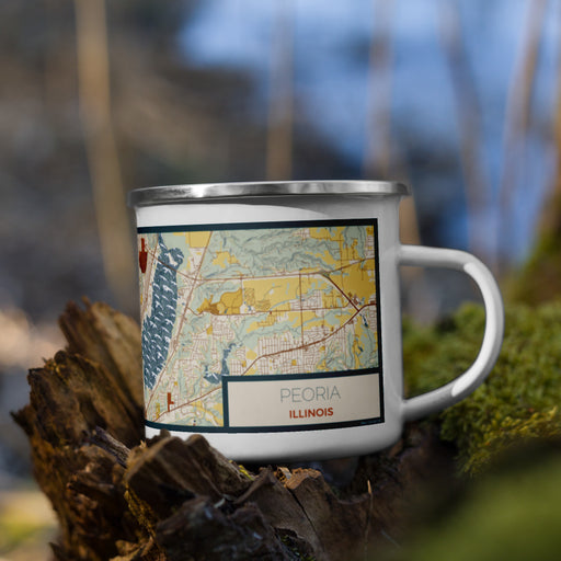 Right View Custom Peoria Illinois Map Enamel Mug in Woodblock on Grass With Trees in Background